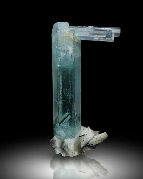 Aquamarine cleaning supplies lineup: soft brush, mild soap, lint-free cloth