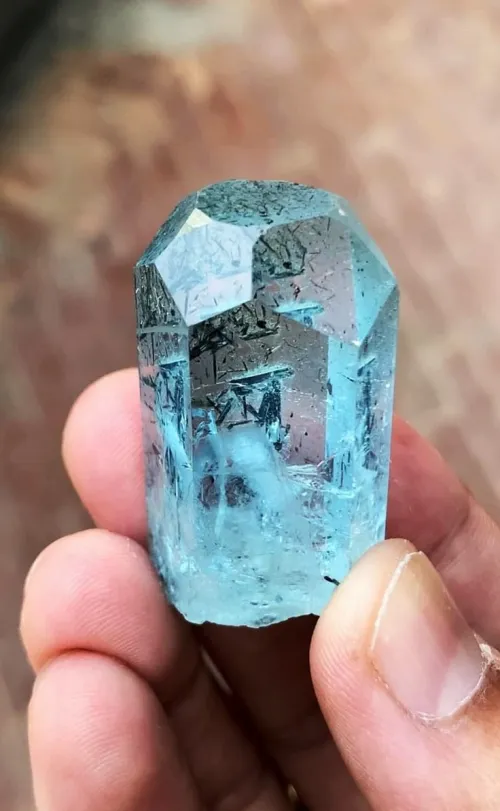 Close-up of aquamarine gem settings showcasing bezel and prong designs