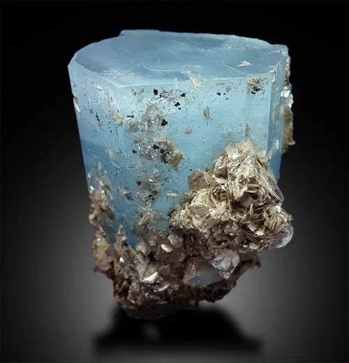 Comparison showing aquamarine color variations next to ocean scenes