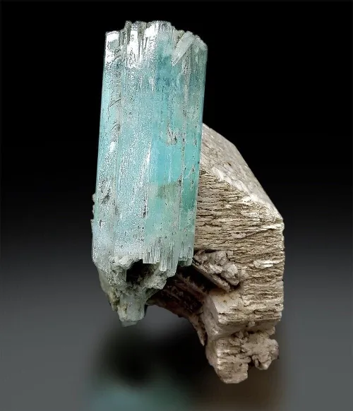 Raw aquamarine crystals showing hexagonal prism shape