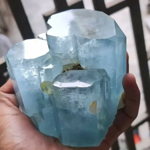 Close-up inspection of aquamarine jewelry settings for water damage signs